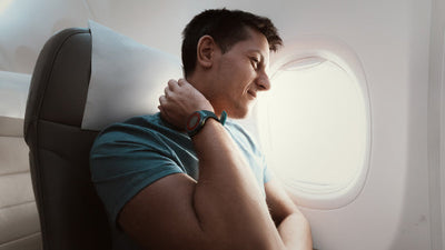 How to Sleep on a Plane Without Waking Up With Neck Pain