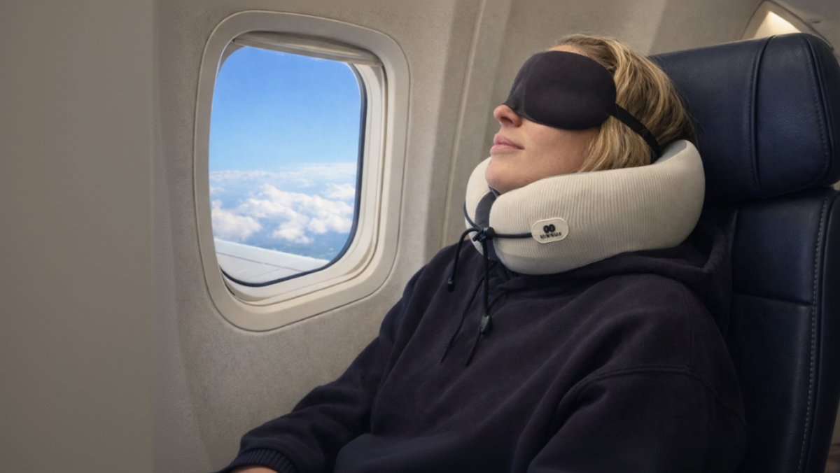 Nimbus memory foam travel pillow on an airplane window seat